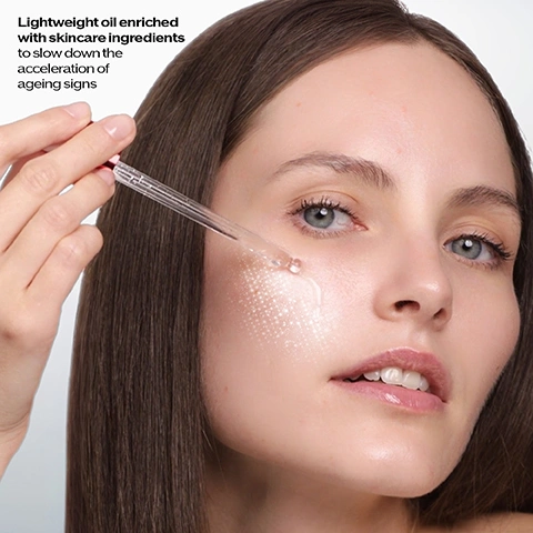 Image 1 - A woman with brown hair applies a clear serum with a dropper to her right cheek, showing a glowing dotted pattern on her skin, and the text Lightweight oil enriched with skincare ingredients to slow down the acceleration of ageing signs. Image 2 - A red Shiseido Ultimune Power Infusing Oil bottle, labeled SHISEIDO ULTIMUNE Power Infusing Oil Huile Activatrice Énergisante, is centrally displayed, surrounded by three clear spheres representing ingredients: a sphere with dark seeds labeled Camellia Seed Extract Helps to rebalance the activity of skins inner defense, a sphere with a red camellia flower labeled Power Fermented Camellia + Helps to activate specific type of defensive cells to eliminate aged cells*, and a sphere with clear liquid labeled Hyaluronic Acid Renowned actives to improve skins moisture, with *in-vitro test at the bottom right. Image 3 - A woman with glowing skin holds a red Shiseido Ultimune Power Infusing Oil bottle, with the text 94% said their skin looks more glowy in 3 days* and *Consumer test by 110 women visible, and the bottle itself features the text SHISEIDO ULTIMUNE Power Infusing Oil Huile Activante Énergisante. Image 4 - Two red Shiseido Ultimune skincare bottles, a serum and an oil, are displayed on a white surface, with text stating 3X more efficient on visible signs of ageing in just 1 week*, SHISEIDO ULTIMUNE Power Infusing Serum Serum Activateur Énergisant, SHISEIDO ULTIMUNE Power Infusing Oil Huile Activante Énergisante, and *Clinical test on 31 women using the oil with Ultimune serum vs serum only. Signs of aging: firmness, nasolabial folds and facial wrinkles. Image 5 - The image displays a Shiseido Hydrating Ritual in four steps: Step 1 PREPARE CLEANSE with Shiseido Clarifying Cleansing Foam For All Skin Types InternalPowerResist, Step 2 DEFEND STRENGTHEN with Shiseido Ultimune Power Infusing Serum, Step 3 GLOW with Shiseido Ultimune New Power Infusing Oil, and Step 4 REGENERATE HYDRATE with Shiseido Essential Energy Hydrating Cream. Image 6 - A fair-skinned woman with blonde hair and bangs poses next to two red Shiseido Ultimune product bottles, a dropper oil and a pump serum, with text that reads NEW ULTIMUNE Power Infusing Oil, CLINICALLY PROVEN: 24H HYDRATION*, IN JUST 3 DAYS, 94% SAW MORE GLOWY SKIN**, * Instrumental test on 25 women., ** Consumer test by 110 women., and the brand SHISEIDO GINZA TOKYO. Image 7 - A red Shiseido Ultimune Power Infusing Oil dropper bottle rests on a subtly rippled white surface, next to a white review box showing ULTIMUNE Power Infusing Oil, five red stars, Lorem Ipsum, by Xxx, and the bottle itself is labeled SHISEIDO ULTIMUNE Power Infusing Oil Huile Activatrice Énergisante.