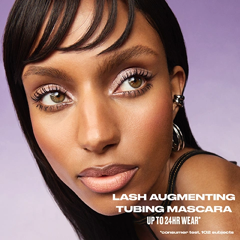 Image 1 - A model with dark skin, shimmery pink eyeshadow, and long, full eyelashes looks at the camera against a purple background, with text that reads Lash Augmenting Tubing Mascara Up to 24HR Wear* *consumer test, 102 subjects. Image 2 - The image displays a before and after comparison of three different pairs of eyes, showing natural lashes on the left and enhanced, longer lashes after applying mascara on the right, with text that reads intense black, NO LASH RETOUCHING, BEFORE, and AFTER. Image 3 - A split image shows a persons eye with natural lashes on the top and the same eye with dramatically lifted and lengthened lashes on the bottom, with text that reads up to 24HR* LIFT + LENGTH no droop and *consumer test, 105 subjects. Image 4 - A close-up of a persons face with smudged mascara running below one eye and a finger with a leopard print nail touching the cheek, next to the text effortless REMOVAL IN SECONDS Just add warm water. Image 5 - The image shows a dark, twisted fiber, likely representing a mascara-coated lash, against a gradient background of light gray fading to purple, with overlaying text that reads: AUGMENTED LASHES IN SECONDS. +34% instant length* +11% lift*. Tube-locking tech wraps every lash for instant lift and length. *instrumental study, 32 subjects. Image 6 - A black mascara wand with a spiky brush is shown on a purple gradient background with text reading: CAPTURES, DEFINES + SEPARATES. Ultra-precise brush that grabs and coats every lash evenly. *vs conventional bristle diameter. Image 7 - A purple gradient background features a mascara brush with serum drops falling on it, illustrating ingredients and benefits; text reads: 96% AGREE LASHES APPEAR HEALTHIER AFTER 7 DAYS** 89% serum formula castor oil hyaluronic acid peptides Leaving lashes feeling strong, conditioned and healthy **based on self- assessment, 105 women. Image 8 - A close-up of a persons face showing their eyes with dramatic purple eyeshadow, black winged eyeliner, and long eyelashes, with visible text that reads instant lift + length smudge + flake resistant MODEL IS WEARING INTENSE BLACK.