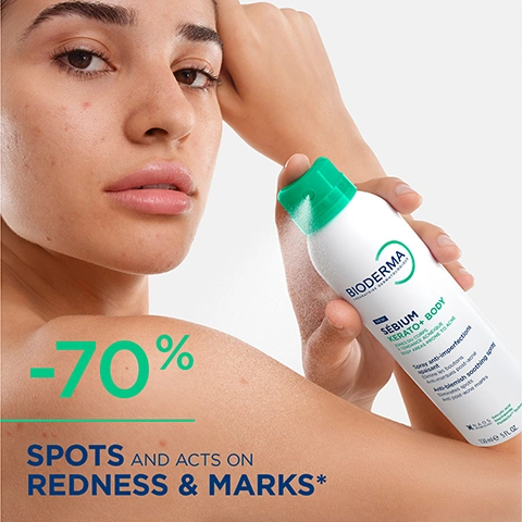 Image 1 - A woman with visible blemishes on her face and shoulder holds a white and green Bioderma spray can, with overlay text -70% SPOTS AND ACTS ON REDNESS & MARKS* and product label text BIODERMA NEW SÉBIUM KERATO+ BODY SOINS DU CORPS À LORGANISME ACNÉIQUE BODY BKA AS PRONE TO ACNE Spray anti-imperfections apaisant Élimine les boutons Anti-marques post-acné Anti-blemish soothing spray Anti-spot Anti-post-acne marks NAOS 150ml 5FL.OZ. Image 2 - A before-and-after comparison of a persons upper back, showing skin with blemishes on the left labeled Day 1 and clearer skin on the right labeled Day 28, with the superimposed text SÉBIUM KERATO+ BODY TRUE SKIN. NO FILTER. Approved by an independent legal authority*. Image 3 - The image displays two white Bioderma skincare products, a tube of Sebium Kerato+ gel-cream for face and a spray bottle of New Sebium Kerato+ Body for body, with text OILY PRONE SKIN FACE Treat BACK Treat BIODERMA LABORATOIRE DERMATOLOGIQUE SÉBIUM KERATO+ PEAUX À TENDANCE ACNÉIQUE ACNE-PRONE SKIN Gel-crème anti-imperfections haute tolérance Anti-blemish high tolerance gel-cream NEW BIODERMA LABORATOIRE DERMATOLOGIQUE SÉBIUM KERATO+ BODY ZONES DU CORPS À TENDANCE ACNÉIQUE BODY AREAS PRONE TO ACNE Spray anti-imperfections apaisant Anti-marques post-acné Anti-blemish soothing spray Eliminates spots Anti-post-acne marks. Image 4 - The image shows three Bioderma Sébium products against a white background for OILY PRONE SKIN. The products are categorized as FACE Cleanse, FACE Treat, and BACK Treat, featuring a blue pump bottle of Bioderma Sébium Gel Moussant Purifying cleansing foaming gel for Combination to Oily Skin, a white tube of Bioderma Sébium Kerato+ Anti-blemish high tolerance gel-cream for Acne-Prone Skin, and a white spray bottle of Bioderma Sébium Kerato+ Body NEUF! Anti-blemish soothing spray for Body Areas Prone to Acne. Image 5 - The image displays five Bioderma Sébium Kerato+ skincare products in white and green tubes and bottles, with the text SÉBIUM KERATO+ DONT JUST FIGHT SPOTS, TARGET THE BREAKOUT CYCLE, and product labels for Bioderma Sébium Kerato+ Cover Anti-blemish high tolerance tinted gel-cream 30 mL, Bioderma Sébium Kerato+ Anti-blemish high tolerance gel-cream 30 mL, Bioderma Sébium Kerato+ Body Anti-blemish soothing spray 150 mL, Bioderma Sébium Gel Moussant Actif Intense purifying cleansing active foaming gel 400 mL, and Bioderma Sébium Kerato+ SPF 50 Anti-blemish high tolerance protective gel-cream 30 mL. Image 6 - A young woman with dark curly hair and visible acne on her face and shoulder holds a white Bioderma Sébium Kerato+ Body spray bottle, with the bottle labeled BIODERMA SÉBIUM KERATO+ BODY Spray anti-imperfections lissant Anti-blemish smoothing spray and the image also showing text Body Breakouts? Cleared From Every Angle.