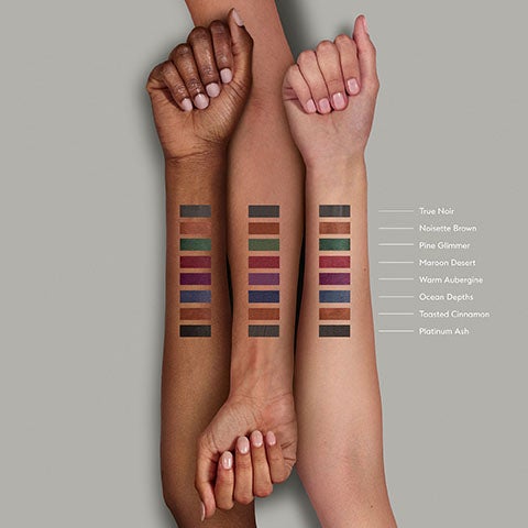 Image 7-noseven-en_GB - Eight makeup swatches displayed across deep, medium, and fair skin tones from True Noir to Platinum Ash.