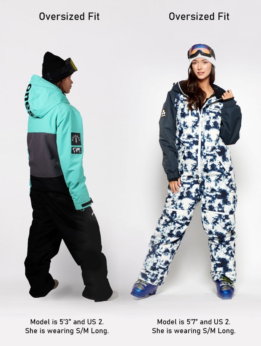 Two Females modelling Ski Suit, first Oversized Fit Model is 5'3" US 2 and is wearing S/M Long. Second Oversized Fit Model is 5'7" US 2 and is wearing S/M Long