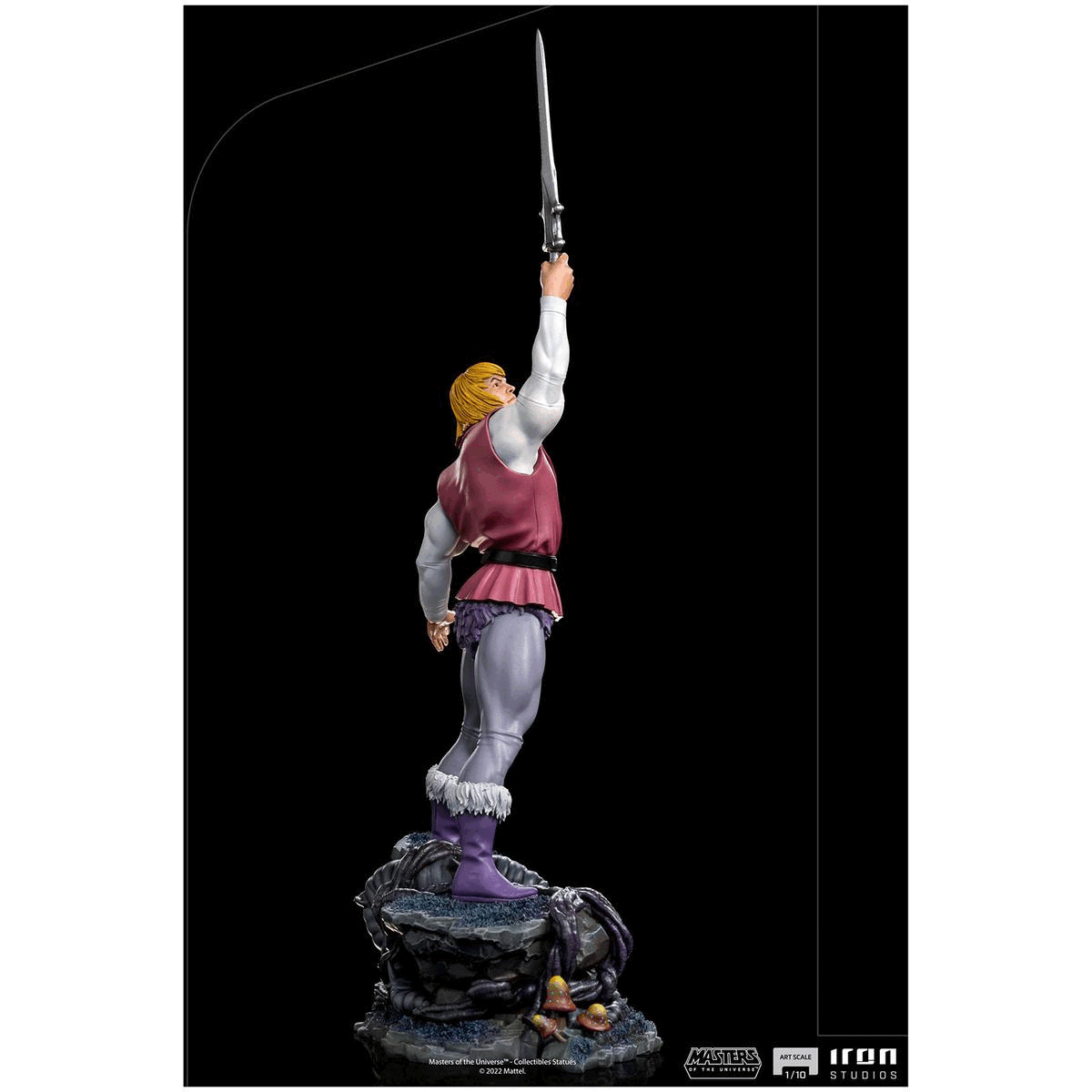 Repeating images in a loop showing the figure from different angles. Text reads, Masters of the Universe collectible statues, Art scale one tenth, Iron Studios.fifteen inches height, seven point four inches width, four point three inches depth. Two point one pounds weight.