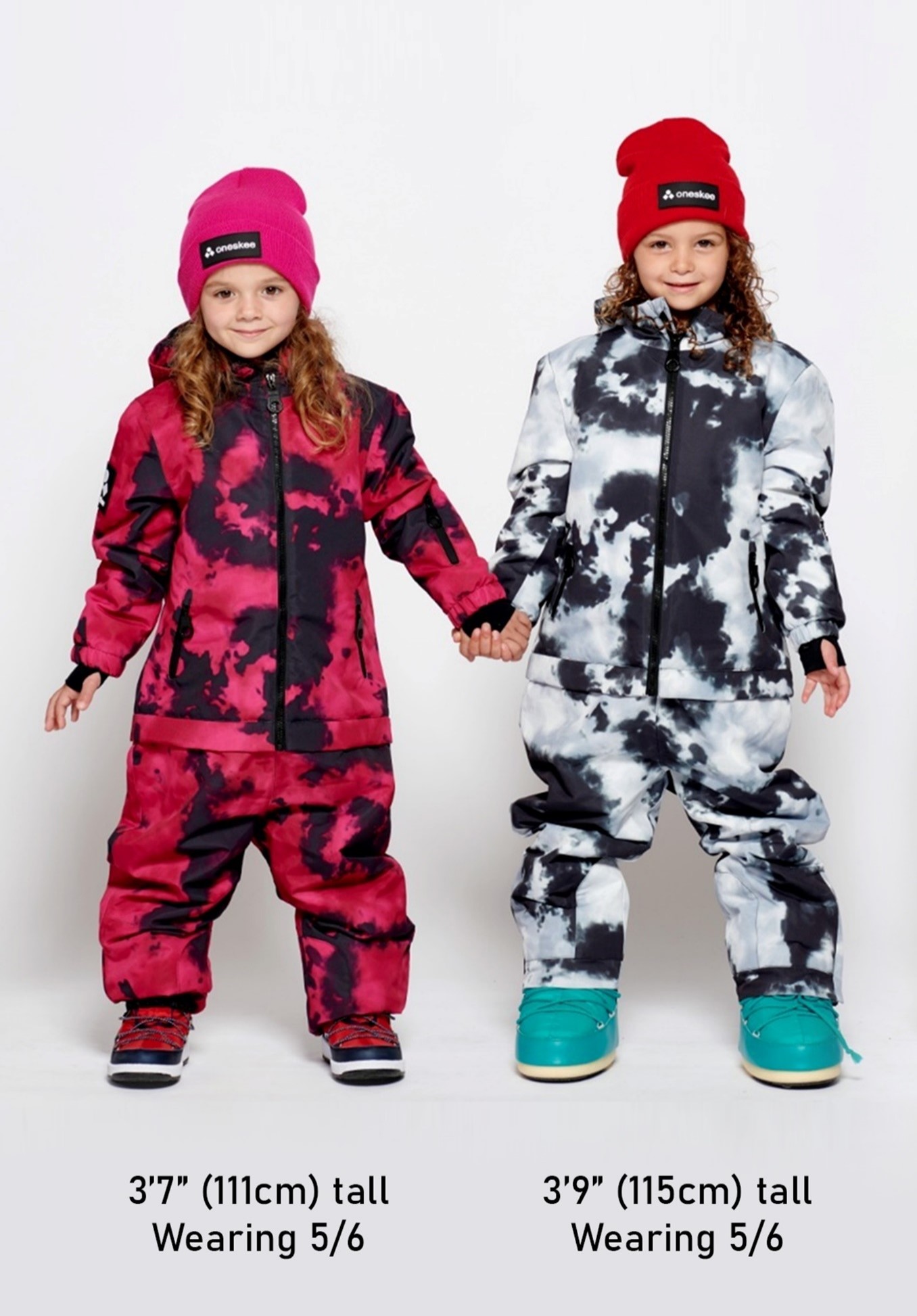 Two children modelling Ski Suits, the model on the left is 3'7" (111cm) tall Wearing 5/6. The model on the right is 3'9" (115cm) tall Wearing 5/6