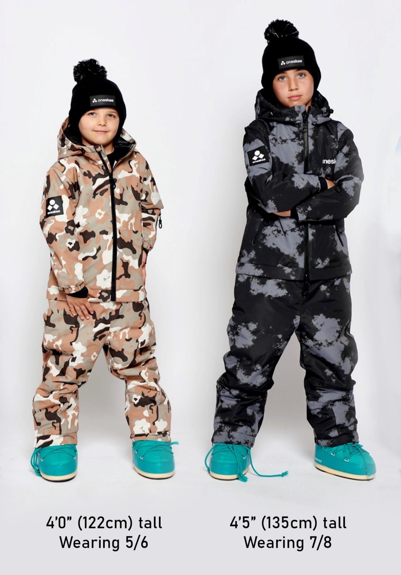 Two children modelling Ski Suits, the model on the left is 4'0" (122cm) tall Wearing. The model on the right is 5/6 4'5" (135cm) tall Wearing 7/8