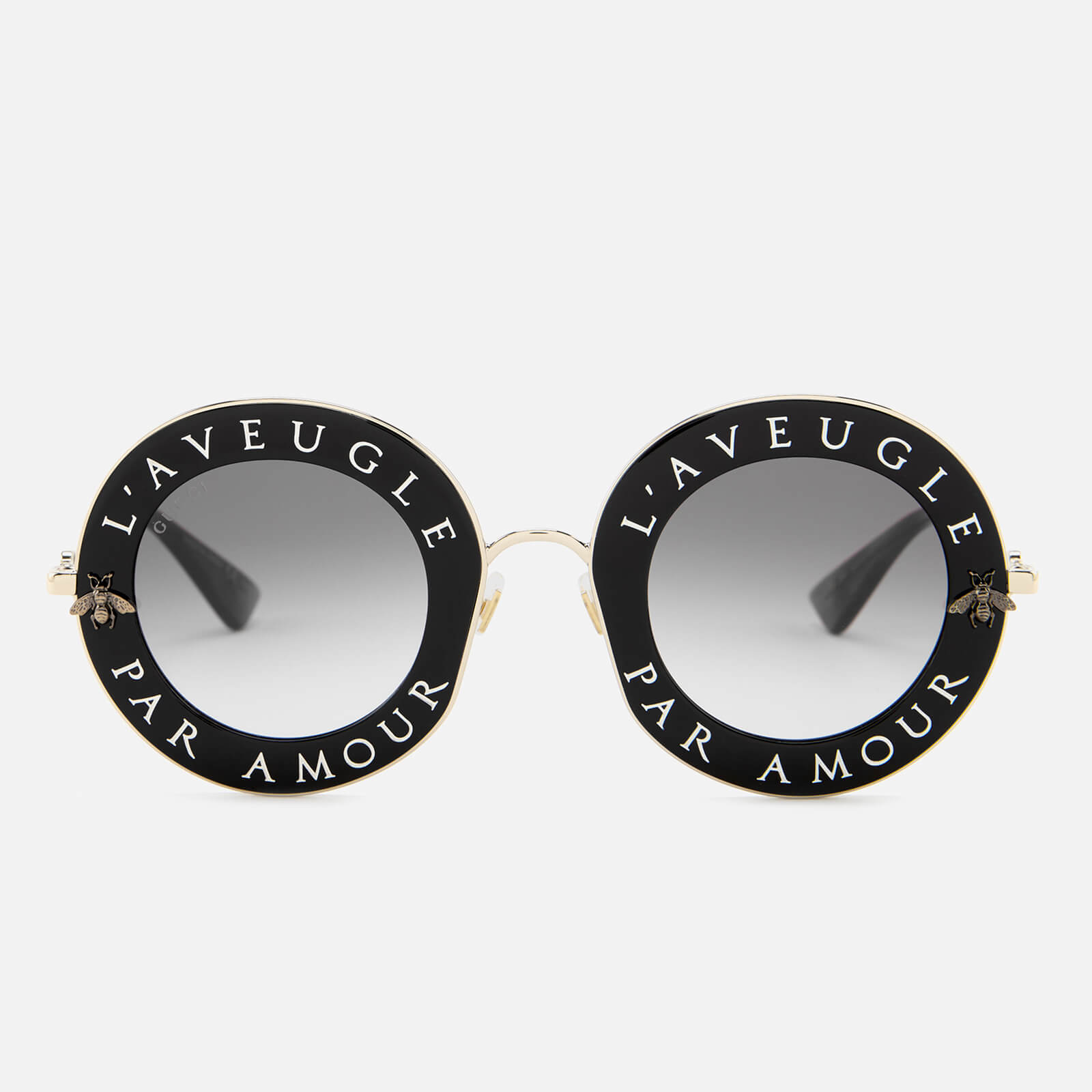 round gucci sunglasses with writing