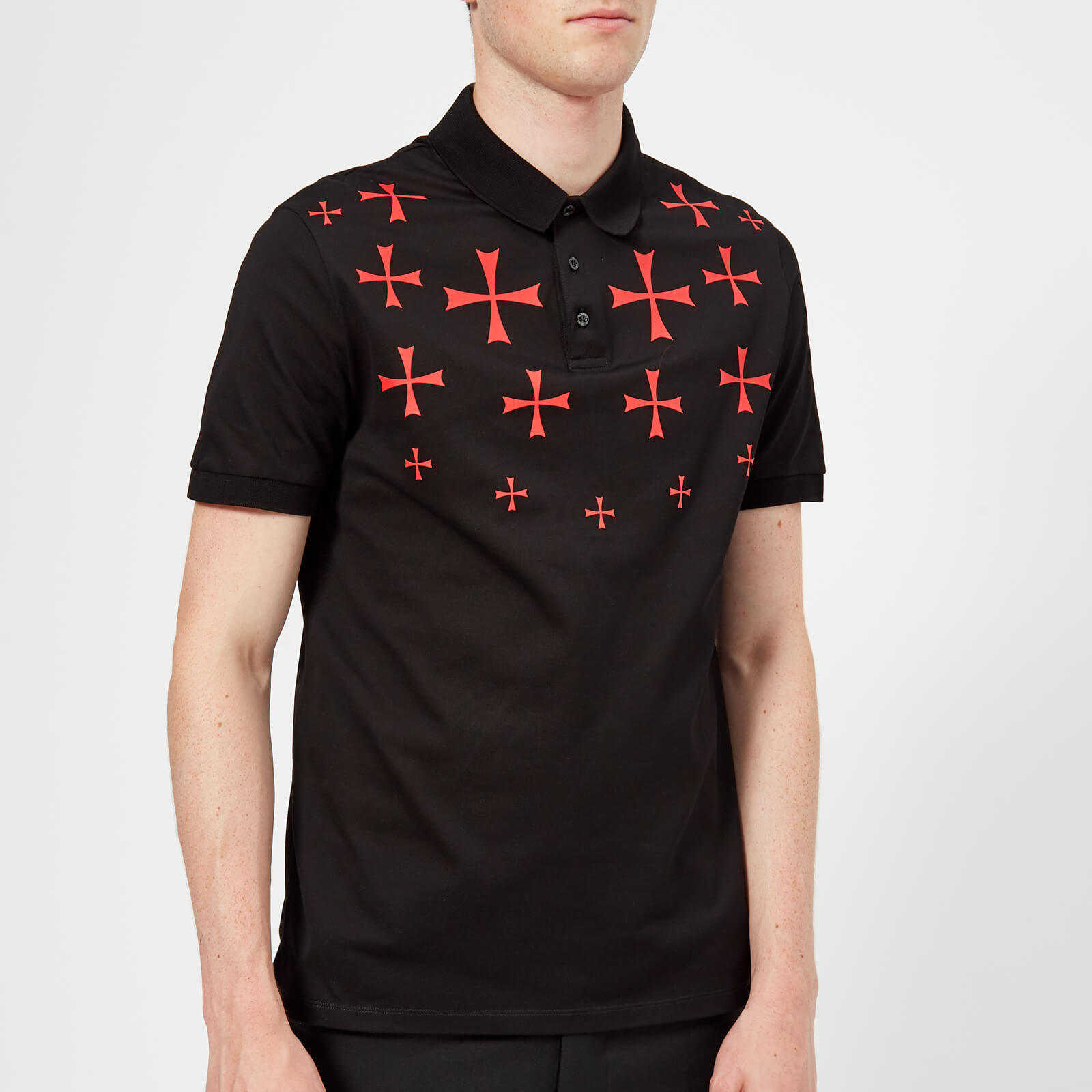 polo shirt and black pants