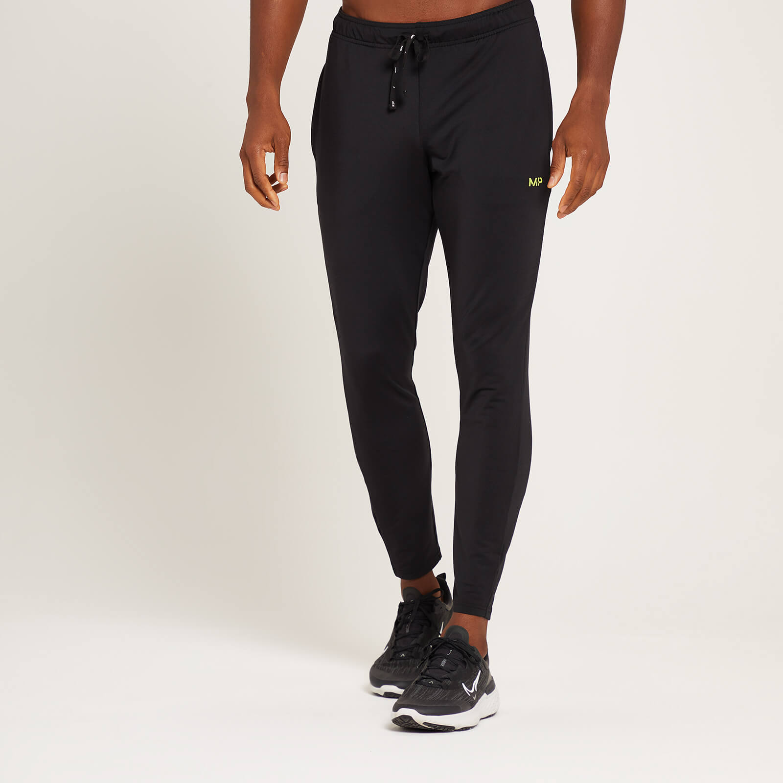 the north face train n logo cuffed joggers in black