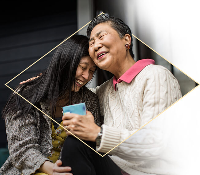 2 women pictured laughing