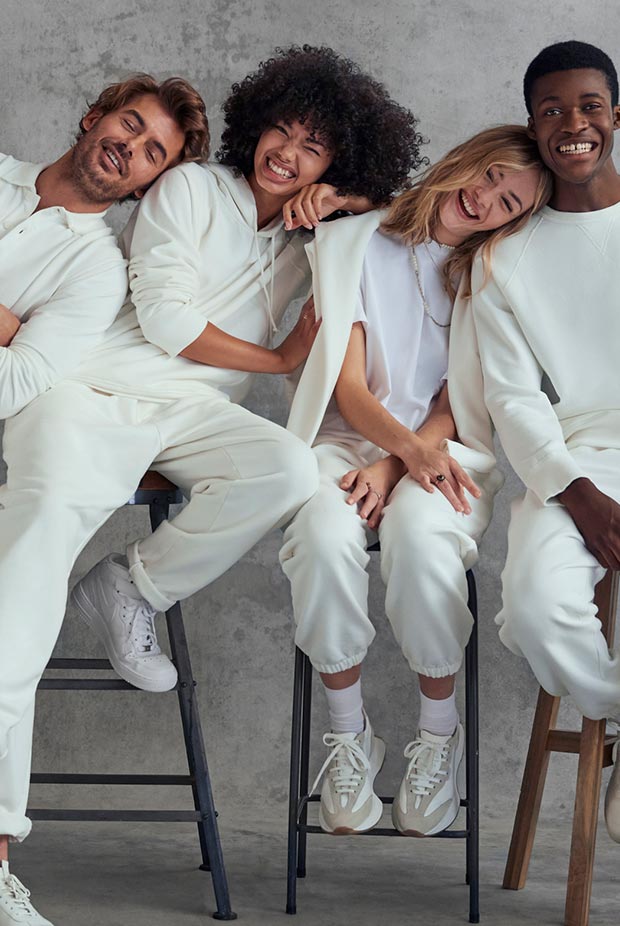 a group of people wearing white david gandy sweats, joggers & jackets