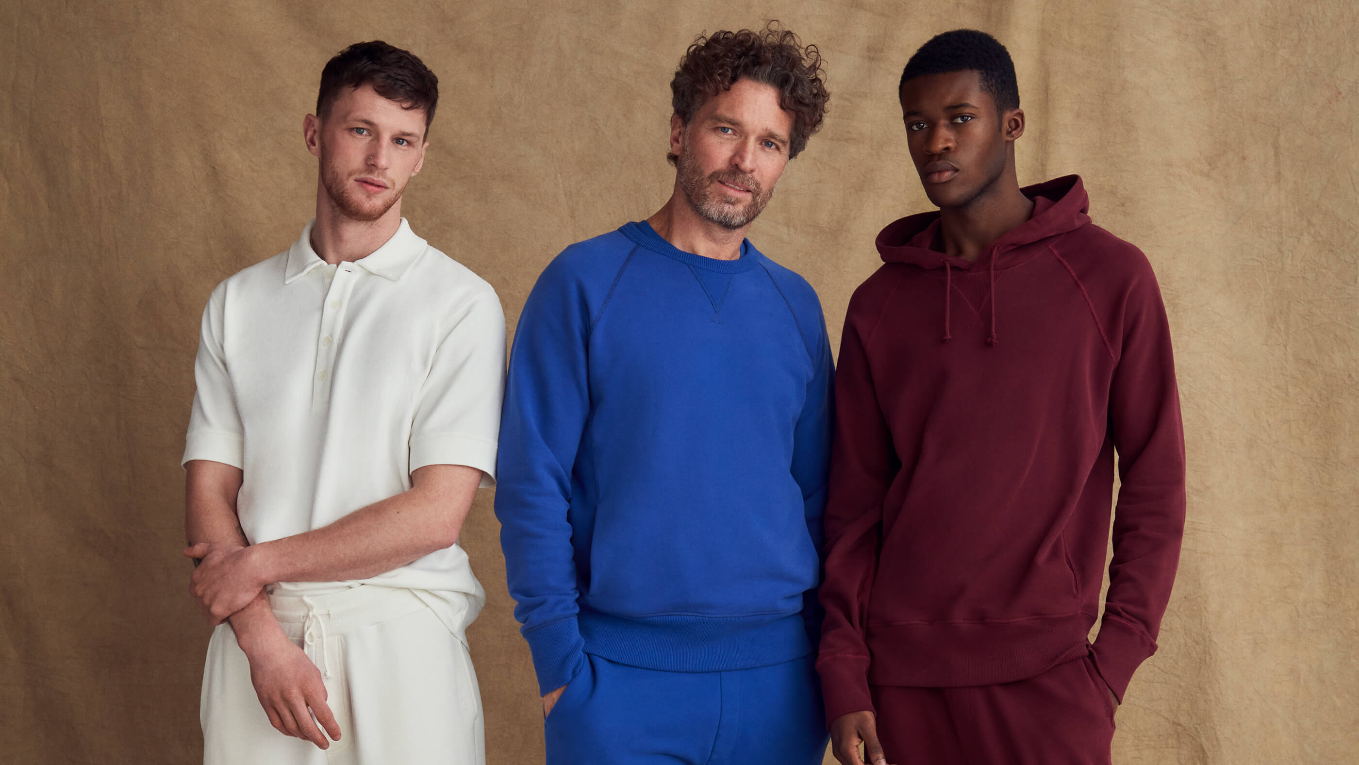 Models wearing off white, blue and burgundy sweats