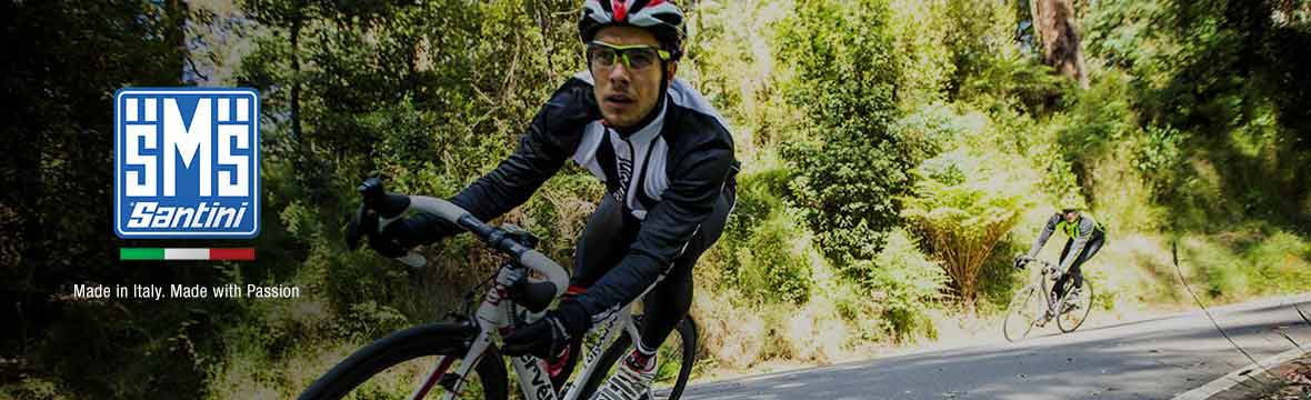 santini logo to the right of an image of a cyclist riding around a bend wearing santini cycling gear